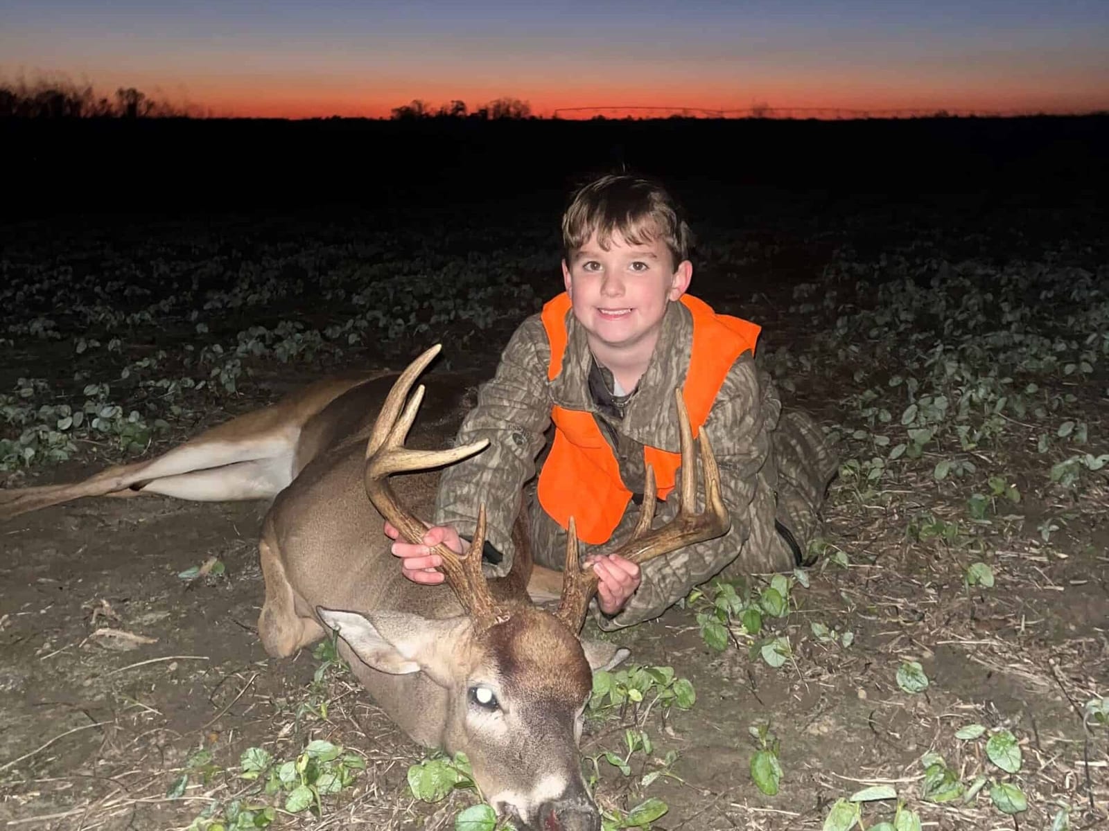 Deer hunting with young hunter at Broomsedge Rod & Gun, showcasing outdoor hunting activities and wi.