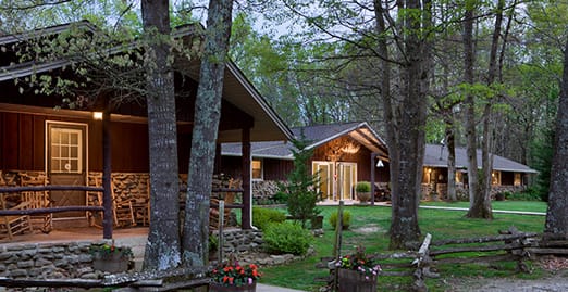The main lodge and guest cabins at dusk