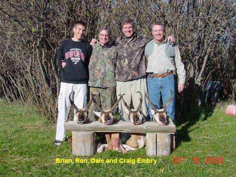 Four Men Standing With Their Antelope Hunts in Montana