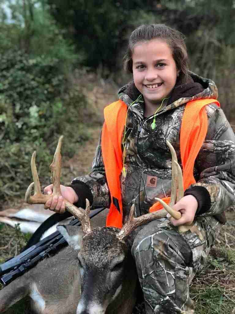 Giana Gilbert with here fist deer at a Georgia Hunting Plantation