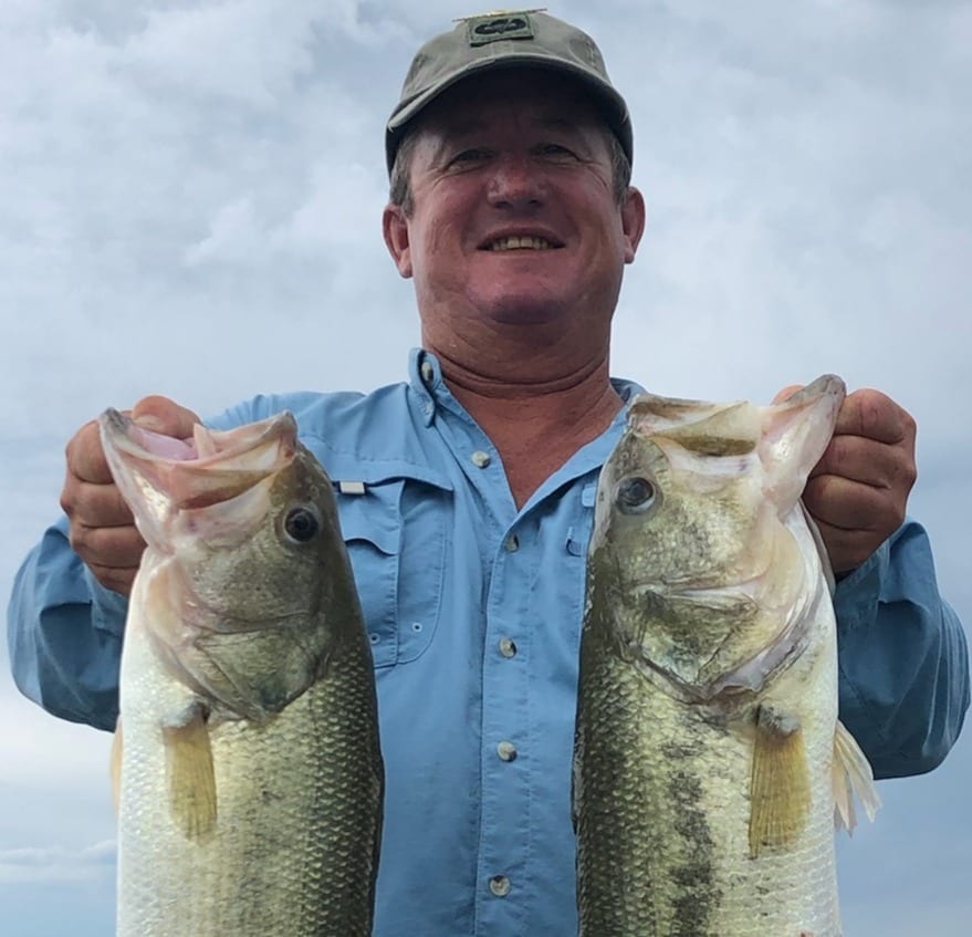 Scott with two large mouth bass.jpg