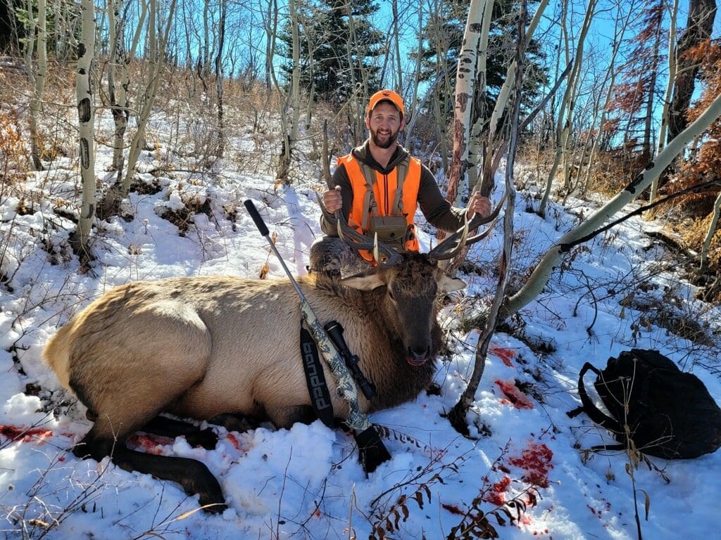 colorado elk hunters with trophy in blaze orange 60