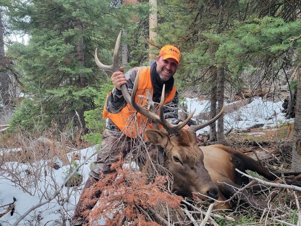 colorado elk hunters with trophy in blaze orange 59