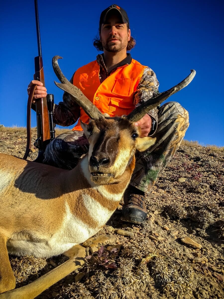 colorado antelope hunter with trophy in blaze orange