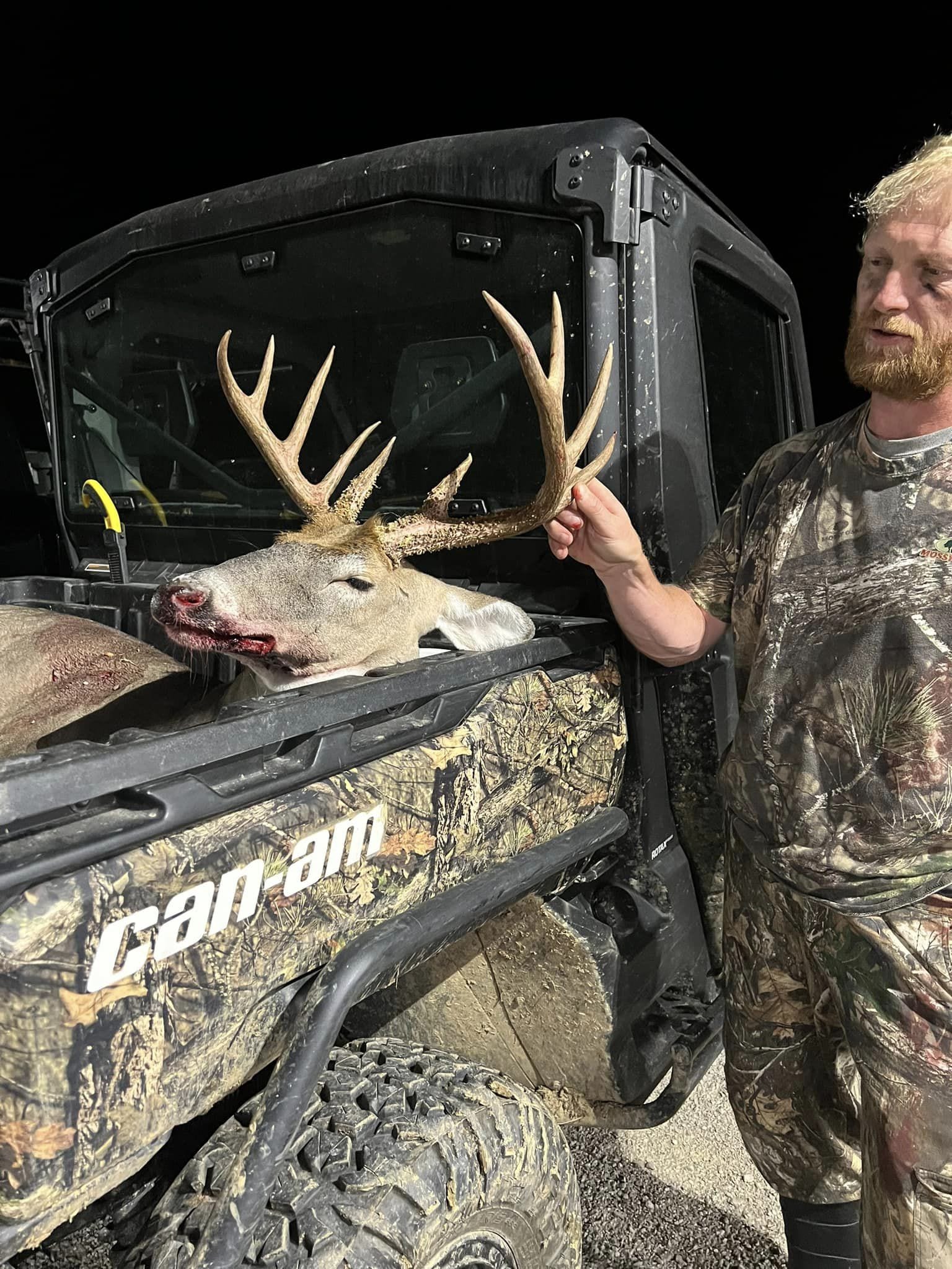 Hunter proudly displays a large buck harvested in Kentucky.