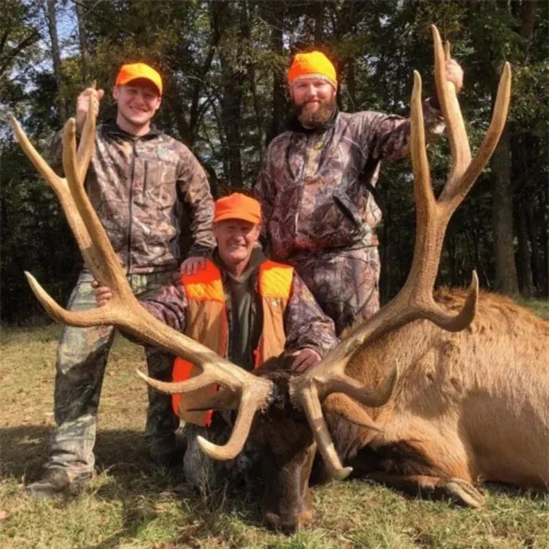 Hunting party with a trophy bull elk